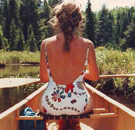 I would've been paddled for a story like this. Woman on a canoe holding a paddle