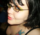 You probably know her too. Crazy girl with tattoo and artsy glasses