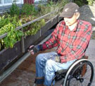 Man gardening from a wheelchair