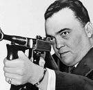 J. Edgar Hoover with a Tommy Gun