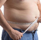 Guy measuring his belly fat