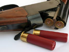 Loaded shotgun and four shells