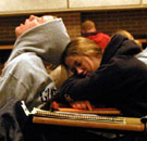 Symbiosis at its deepest state. Two students sleeping during a college lecture