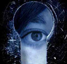 The key to your heart is right through your hole. Eye looking through a keyhole