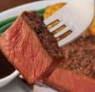Steak piece with a fork in it