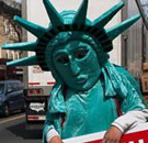 Tax man in Statue of Liberty costume