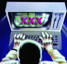 Guy watching XXX at the computer.