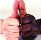We all know how this thumb war's going to end. White and black persons' thumbs up together