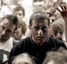 When in trouble, get stoned and bloody and try to blend in. Guy surviving in the middle of a zombie attack