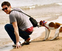 Bill Dixon on the beach with his dog