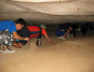 Group in a cave, one guy farts