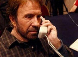 Chuck Norris looks old on the phone with Mike Huckabee