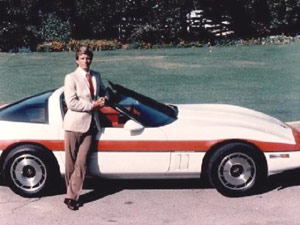 Smooth talking man next to his 1980 Corvette