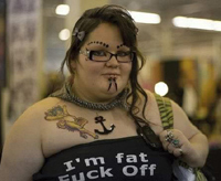 Don't be fooled, it's merely a ploy to pull you closer... Fat girl wearing a Fuck Off tshirt