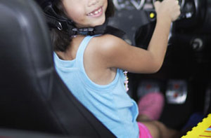 Girl child drives a car