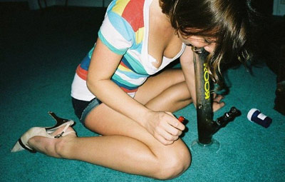 Girl smoking a marijuana bong