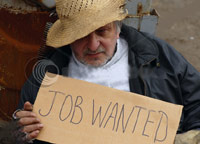 Homeless man holding 'Job Wanted' sign