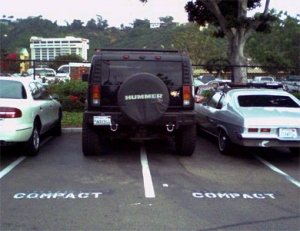 Hummer parked in a compact parking space