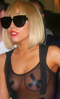 Lady Gaga with taped X's on her nipples