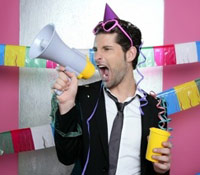 Guy with a party hat and megaphone