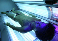 Man in a tanning bed