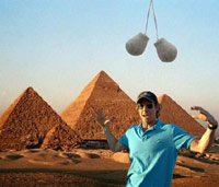 Michael Bay in front of Egyptian pyramids with truck nuts hanging from above