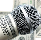 Microphone wrapped in hundred dollar bills