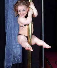 Midget stripper girl dancing on a pole