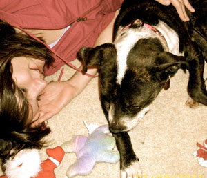 Molly cuddling with her boxer Tessa