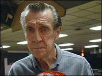 Old man in a bowling league game