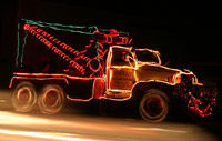 Party Tow Truck decorated with Christmas lights