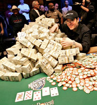 Poker pro with cash and chips on a poker table