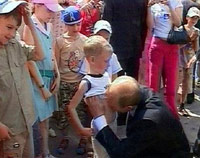 Putin kissing a 5-year-old's stomach