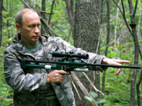 Putin carrying a tranquilizer gun.