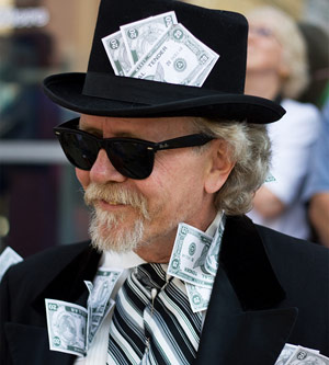 Rich man with a hat on with money in it