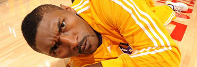 Ron Artest making a weird face while laying on an NBA floor