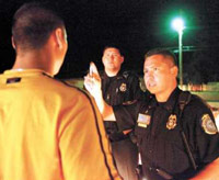Police officer administering field sobriety finger test