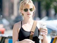 Reese Witherspoon drinking a Starbucks skinny latte