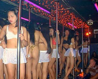 Strip club girls posing in line on stage