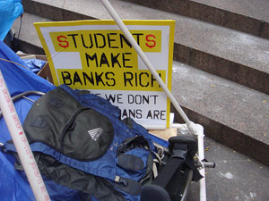 Students make banks rich (sign)