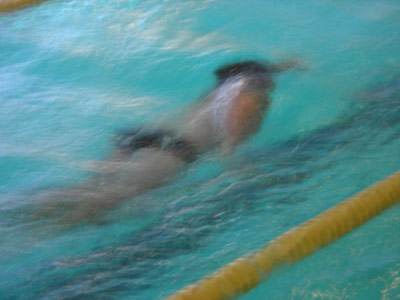 KC swimming in the pool during a race