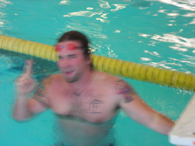 KC gives a number one sign in the swimming pool