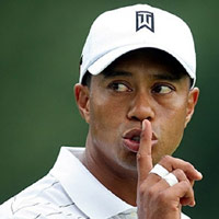 Tiger Woods with his finger to his mouth