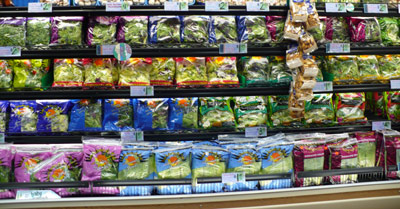 Shelves of Trader Joe's lettuce