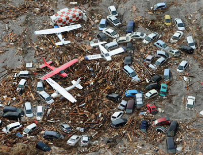 Tsunami trash includes cars, trucks and airplanes