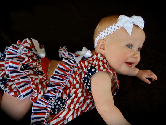 Baby wearing Fourth of July overalls