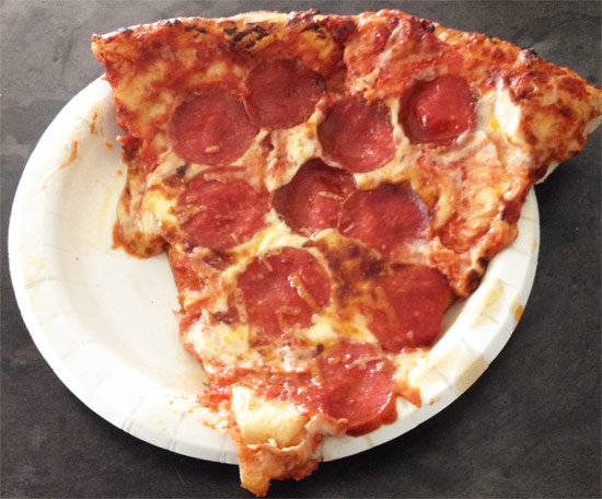Big slice of New York frozen pizza