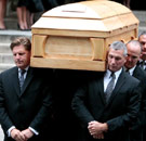 Carrying funeral casket