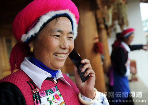 Chinese middle class woman with a flip cell phone
