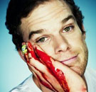 Dexter Morgan smiling with blood on his face
